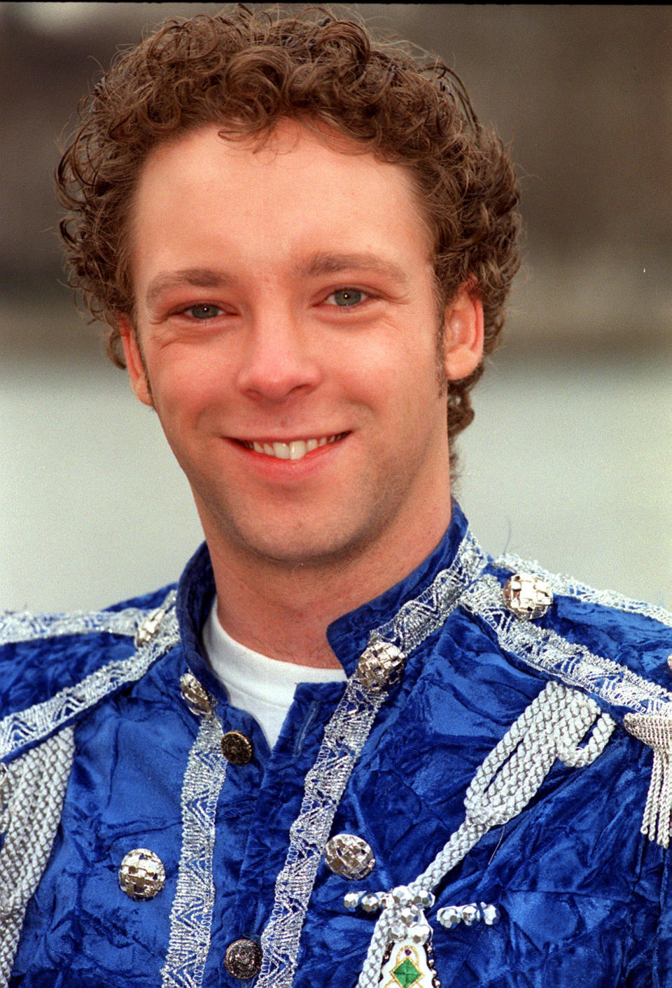 Actor Brett Cousin, who has starred in the Australian television programme 'Neighbours', poses in the costume of Prince Charming at a photocall in London. He is to play the role in a  pantomime at the Central Theatre in Kent.   (Photo by Neil Munns - PA Images/PA Images via Getty Images)