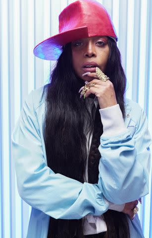 <p>Andrew J Cunningham/Getty</p> Erykah Badu attends an event in March 2023.