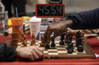 Tunde Onakoya, 29, a Nigerian chess champion and child education advocate, plays a chess game in Times Square, Friday, April 19, 2024 in New York. (AP Photo/Yuki Iwamura)