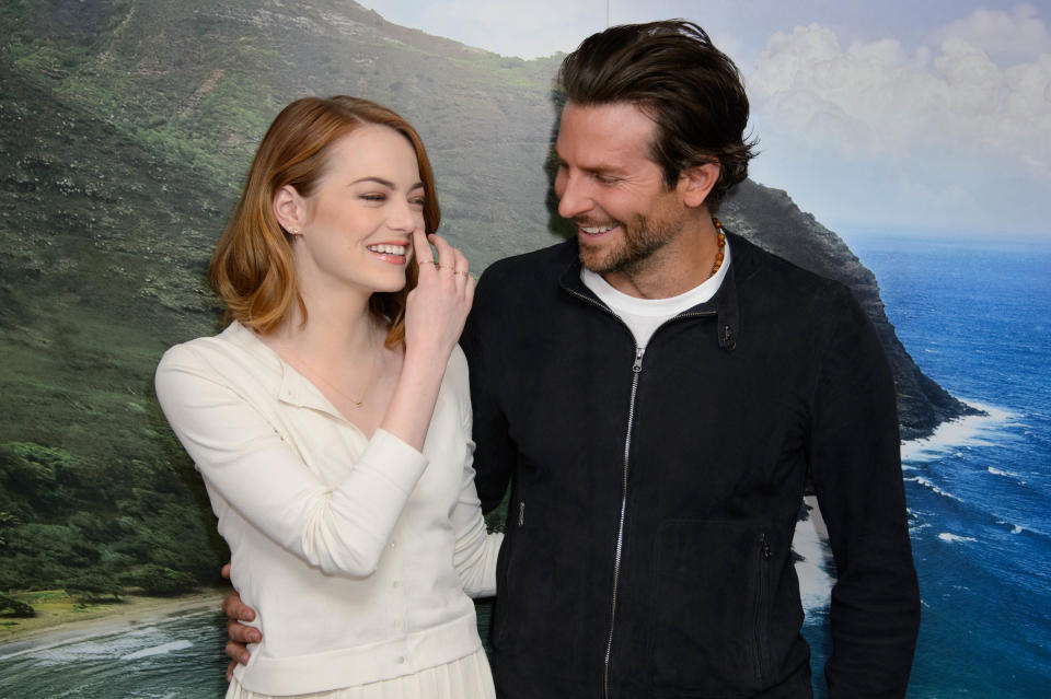 U.S actors Emma Stone, left, and Bradley Cooper pose for photographers at a photocall for Aloha at a central London venue, Saturday, May 16, 2015. (Photo by Jonathan Short/Invision/AP)