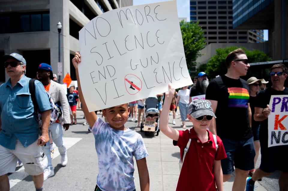 Golden Kindred, 8, and Charlotte Gittins, 11,  walk in the March for Our lives protest in Nashville , Tenn., Saturday, June 11, 2022. The march was part of a nation wide protest advocating for stricter gun control laws.