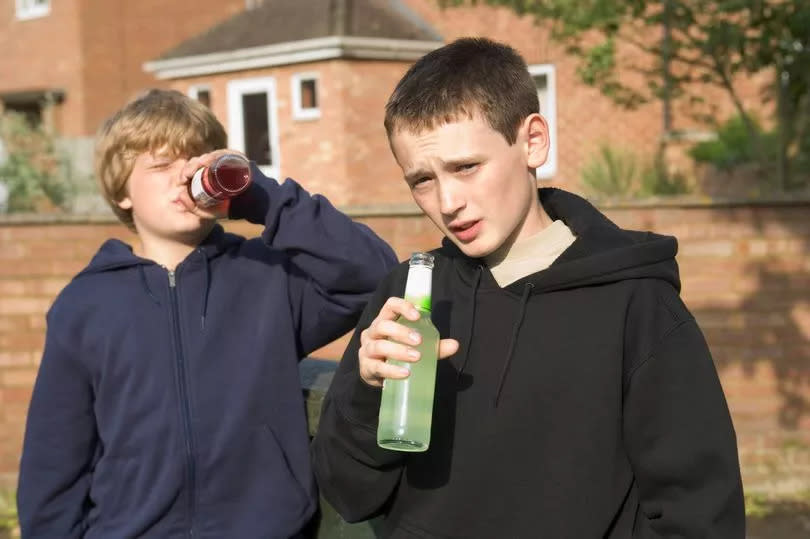 Kids having a drink. Stock image. generic alcohol