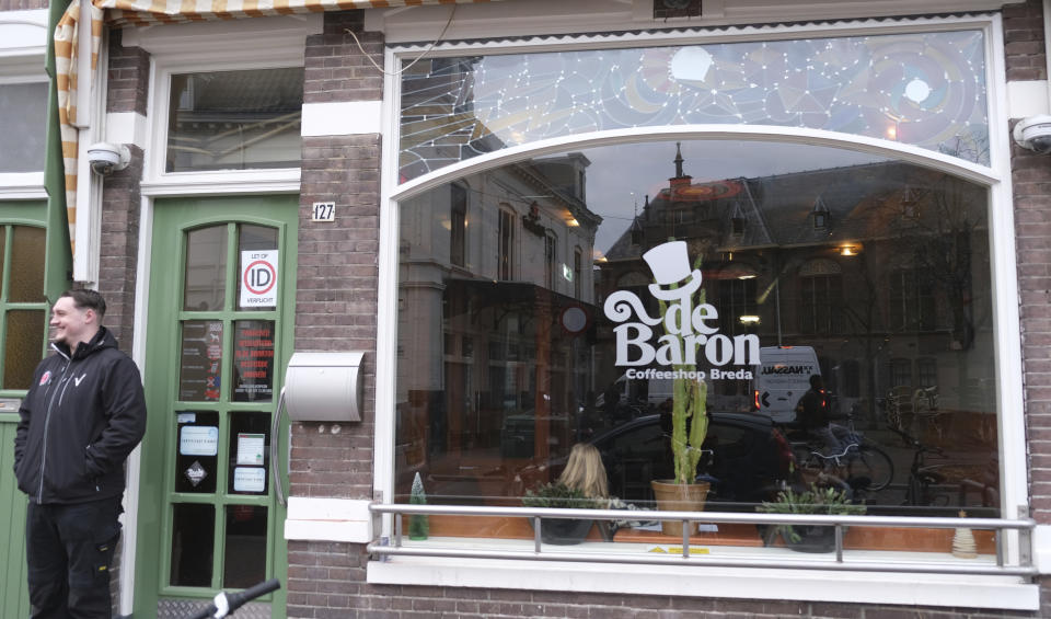 The entrance of coffeeshop De Baron in the southern Dutch city of Breda, after Health Minister Ernst Kuipers visited to launch a new policy on pot growing in two Dutch cities, Friday, Dec. 15, 2023. A paradox at the heart of the Netherlands' permissive pot policy went up in smoke Friday in two Dutch cities as “coffeeshops” began selling the country's first legally cultivated cannabis as part of an experiment to regulate the trade. (AP Photo/Mike Corder)