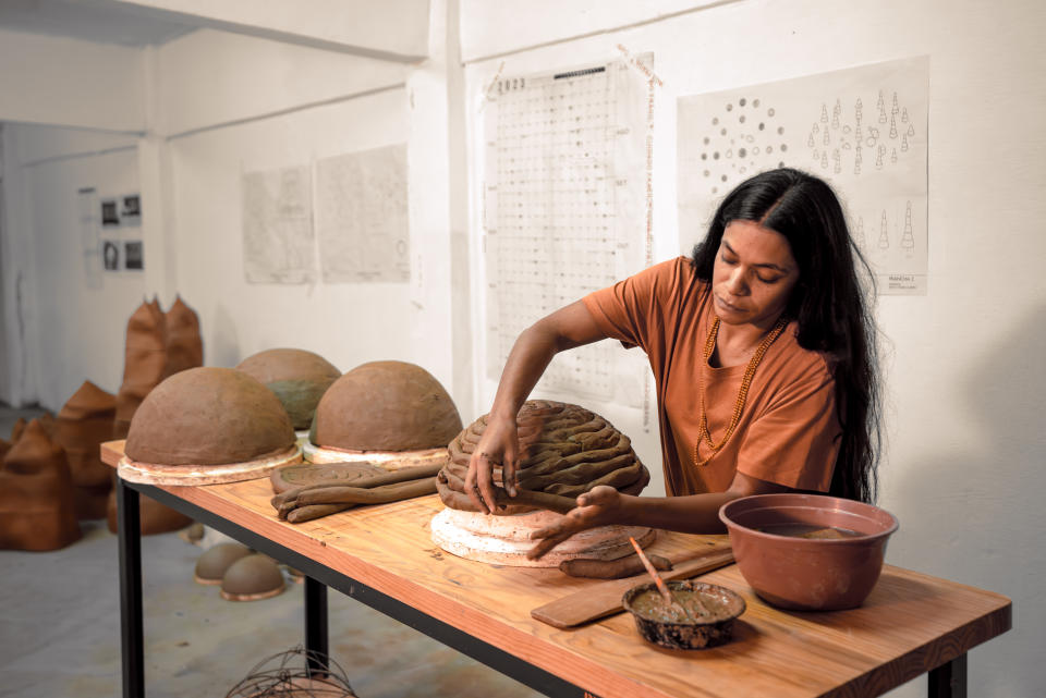 Artist Sallisa Rosa in her studio in Rio de Janeiro working on individual ceramic elements for Topography of Memory.