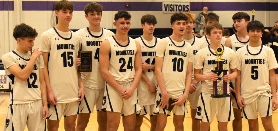 The Little Falls Mounties pose with their trophy after beating Waterville in the championship game at the Little Falls Holiday Classic.