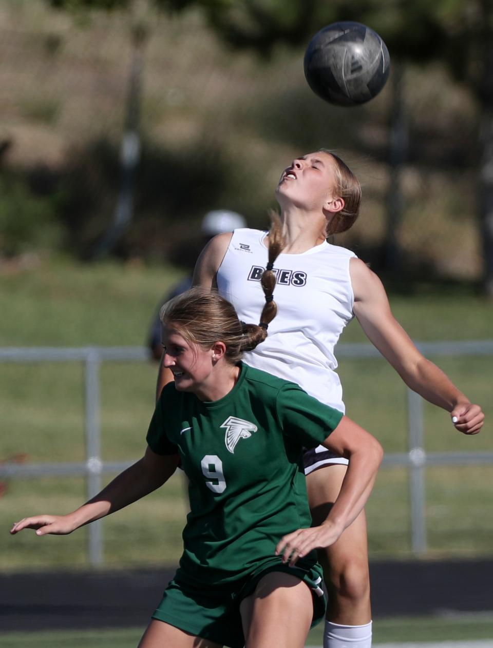 Clearfield’s Carlie Hobbs and Box Elder’s Halli Wright reach for a header during a girls varsity soccer game at Clearfield High School in Clearfield on Thursday, Sept. 14, 2023. Clearfield won 2-1. | Kristin Murphy, Deseret News