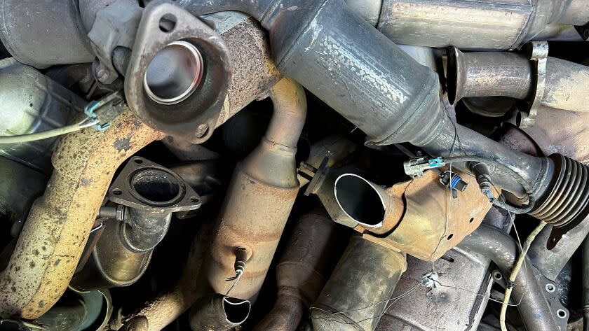 This photo provided by the Phoenix Police Department shows stolen catalytic converters that were recoverd after detectives served a search warrant at a storage unit in Phoenix on Thursday, May 27, 2022. The bust came amid a national surge in thefts of the pricy auto parts that play a critical in reducing vehicle emissions and has led lawmakers in 36 states and in Washington D.C. to consider new laws to address the problem. (Phoenix Police Department via AP)