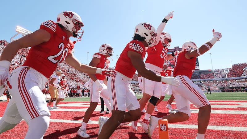 Utah Utes linebacker Karene Reid (21) celebrate his pick-six against the UCLA Bruins in Salt Lake City on Saturday, Sept. 23, 2023.