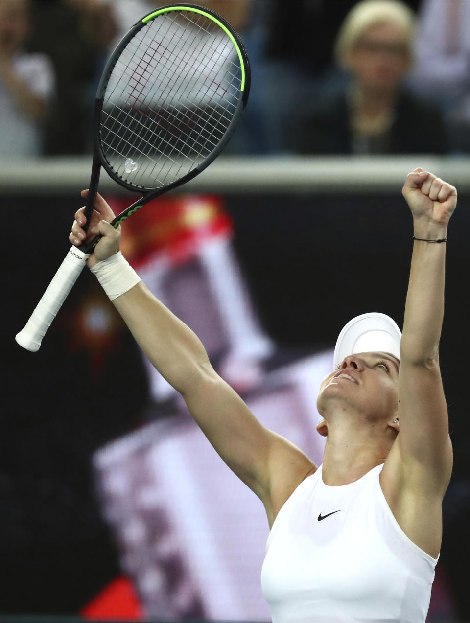 Romania's Simona Halep reacts after defeating Jennifer Brady of the U.S. in their first round singles match at the Australian Open tennis championship in Melbourne, Australia, Tuesday, Jan. 21, 2020. (AP Photo/Dita Alangkara)