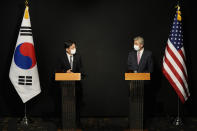 U.S. Special Representative for North Korea, Sung Kim, right, and South Korea's Special Representative for Korean Peninsula Peace and Security Affairs Noh Kyu-duk attend a briefing after their meeting at a hotel in Seoul, South Korea, Sunday, Oct. 24, 2021. (AP Photo/Ahn Young-joon, Pool)