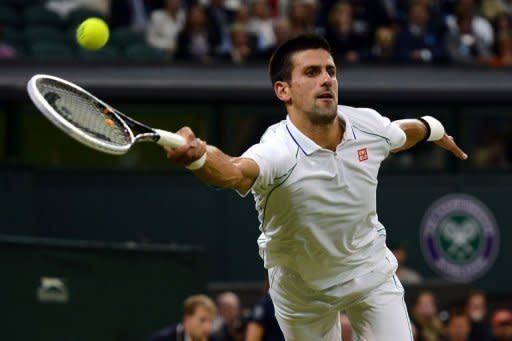 Serbia's Novak Djokovic plays a forehand shot during his fourth round men's singles victory over compatriot Viktor Troicki on day seven of the 2012 Wimbledon Championships at the All England Tennis Club in Wimbledon, southwest London. Djokovic won 6-3, 6-1, 6-3