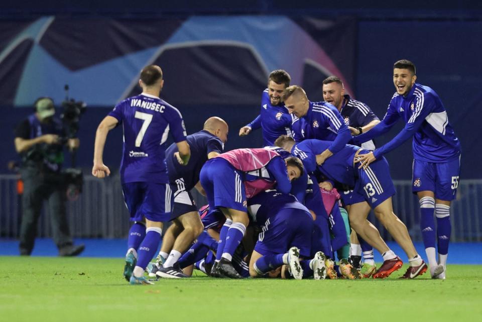 Dinamo Zagreb players celebrate qualifying for the Champions League. (REUTERS)