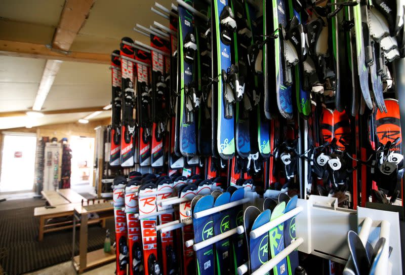 Pairs of skis are displayed in a ski equipment rental store at the ski resort of The Mourtis, as the ski slopes are closed due to lack of snow in Boutx