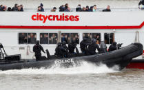 Armed counter terrorism officers of the London Metropolitan Police, take part in a training exercise to rescue hostages, played by actors, from a cruise boat on the river Thames, in London, Britain March 19, 2017. REUTERS/Peter Nicholls