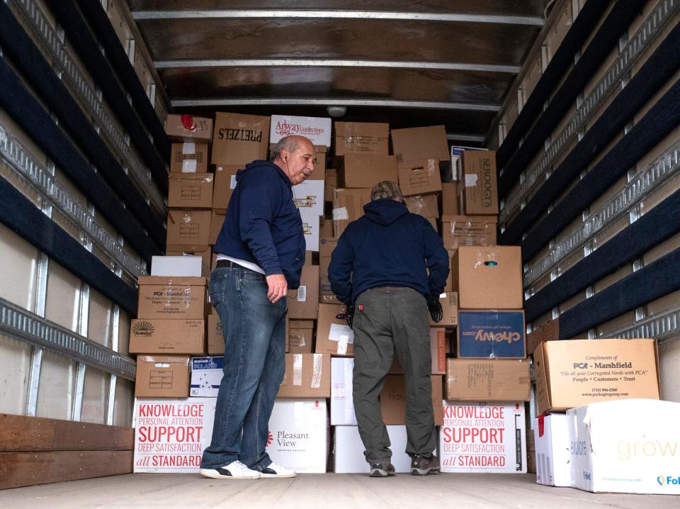 Volunteers with Wisconsin Ukrainians Inc. fill a truck provided by Fox Valley Technical College with donated supplies for the people of Ukraine on March 22 at St. Matthew Orthodox Church in Green Bay. The nonprofit group has sent more than 115,000 pounds of humanitarian, medical and military aid since Russia attacked Ukraine.