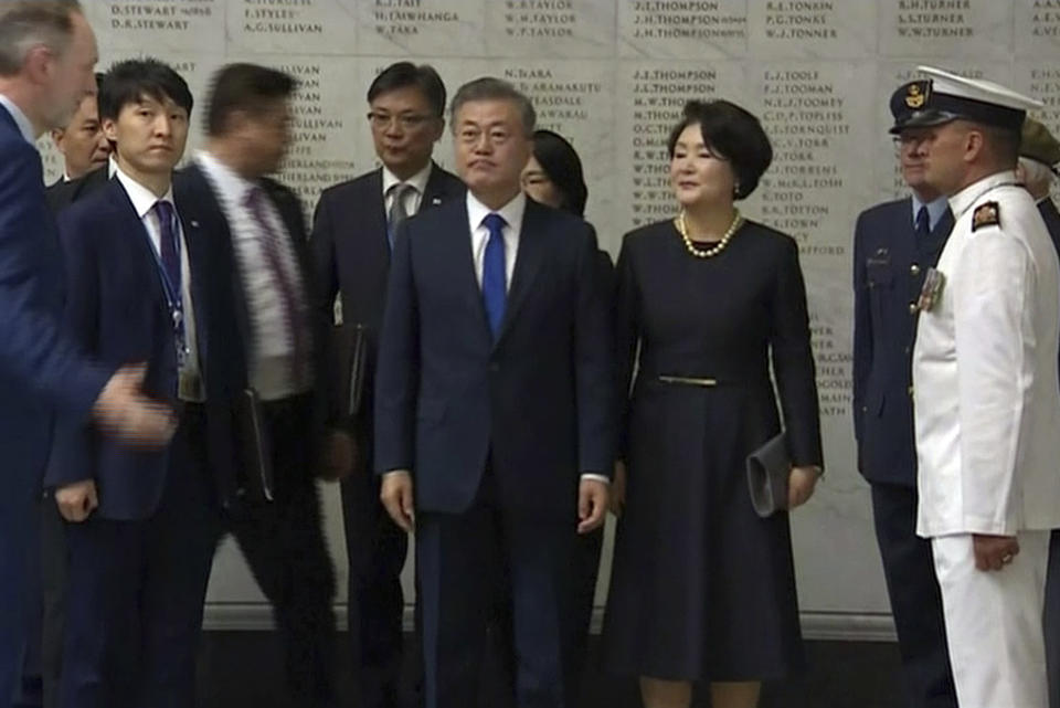 In this image made from a video, South Korean President Moon Jae-in, center, and his wife Kim Jung-sook arrive at the Auckland War Memorial Museum in Auckland, New Zealand Monday, Dec. 3, 2018. Moon is on a two-day visit to New Zealand. (TVNZ via AP)