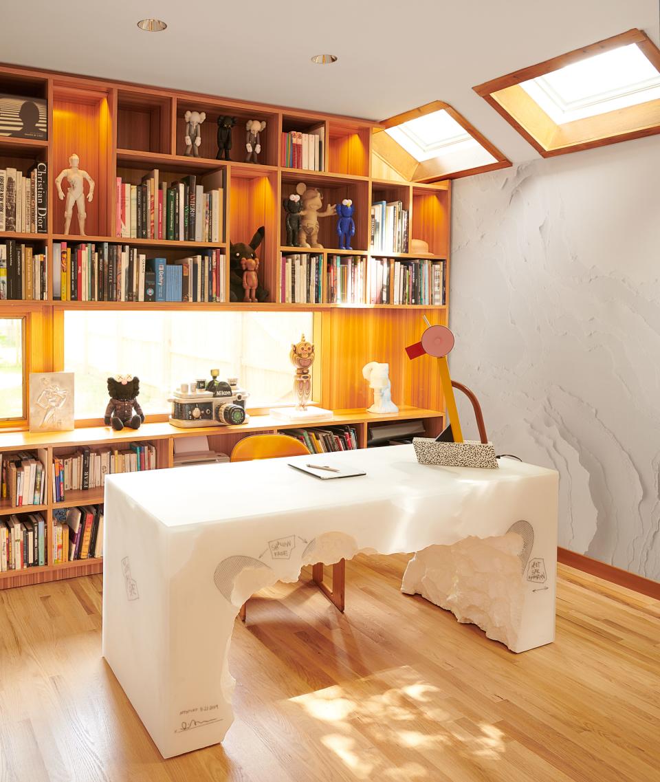 In the study, an Ettore Sottsass lamp sits atop a desk by Arsham.