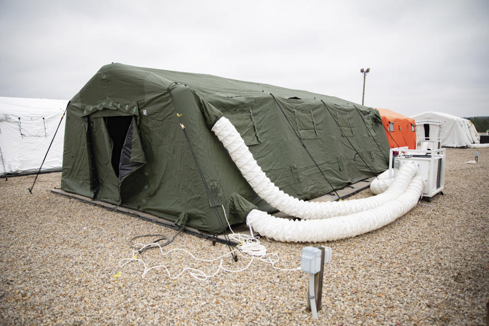 This photo provided by the U.S. Army shows large tents The 82nd Airborne Division has established to provide accommodations for up to 600 soldiers, shown March 17, 2020 at Fort Bragg, N.C. In one of Bragg's remote training areas, large tents have popped up over the last few days to house hundreds of 82nd Airborne Division troops that are returning to the base from Afghanistan and other Middle East deployments. (U.S. Army photo by Sgt. 1st Class Zach VanDyke via AP)