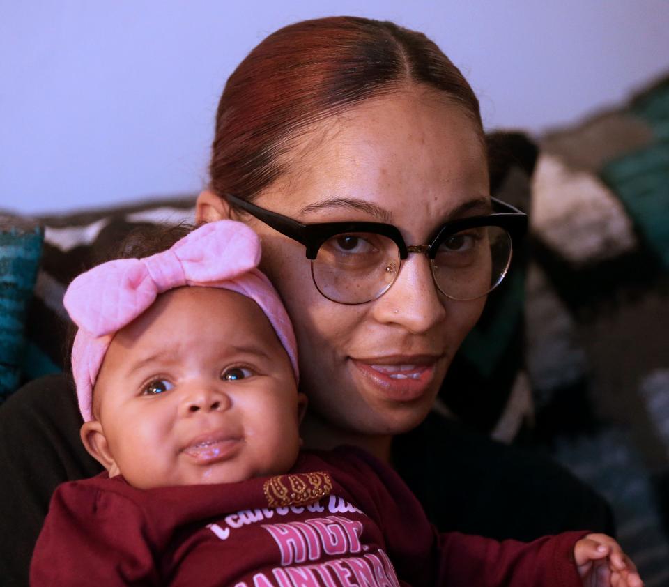 Kristy Bassel is pictured with 3 month-old Cali in Milwaukee on Nov. 22. This is Bassel's sixth child and she said that having a doula taught her a lot.