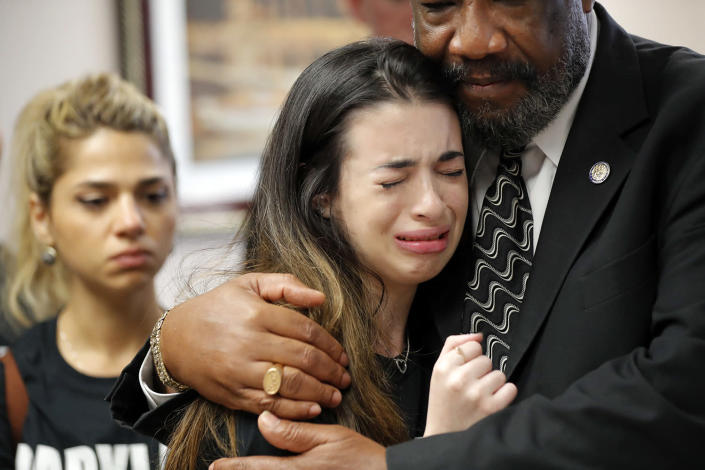 <p>Aria Siccone, 14, a 9th grade student survivor from Marjory Stoneman Douglas High School, where more than a dozen students and faculty were killed in a mass shooting on Wednesday, cries as she recounts her story from that day, while state Rep. Barrinton Russell, D-Dist. 95, comforts her, as they talk to legislators at the state Capitol regarding gun control legislation, in Tallahassee, Fla., Wednesday, Feb. 21, 2018. (Photo: Gerald Herbert/AP) </p>