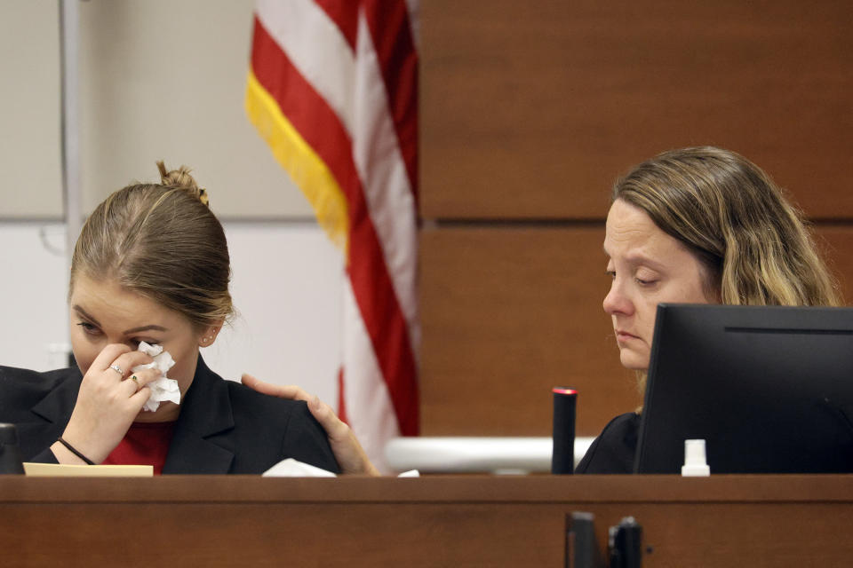 Kelly Petty, right, comforts her daughter, Meghan Petty, as she gives her victim impact statement during the penalty phase of Marjory Stoneman Douglas High School shooter Nikolas Cruz's trial at the Broward County Courthouse in Fort Lauderdale, Fla., Monday, Ag. 1, 2022. Petty's younger daughter, Alaina, was killed in the 2018 shootings. Cruz previously plead guilty to all 17 counts of premeditated murder and 17 counts of attempted murder in the 2018 shootings. (Amy Beth Bennett/South Florida Sun Sentinel via AP, Pool)