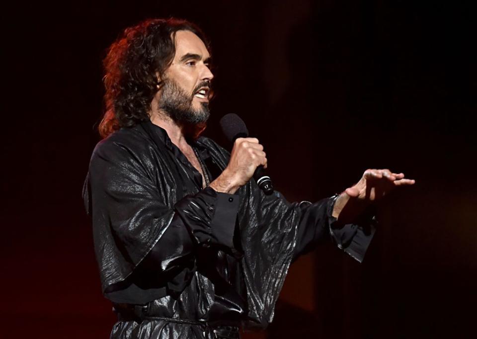 russell brand speaks on stage