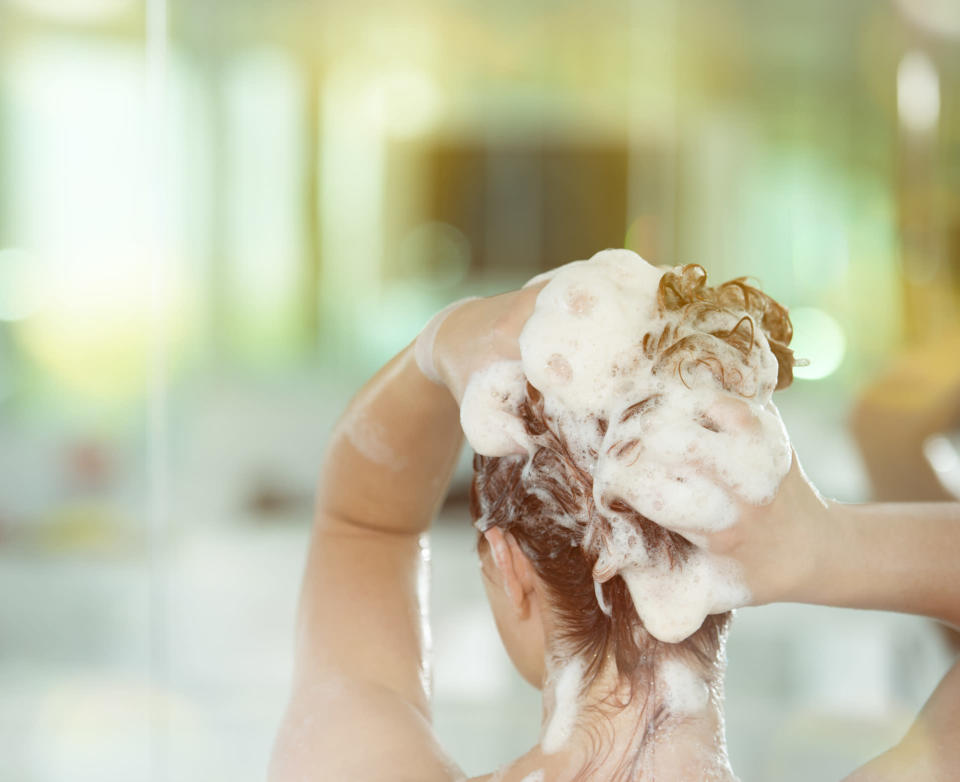 Is it possible to train your hair to need less washing? [Photo: Getty]
