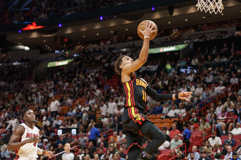 MIAMI, FL - APRIL 11: Trae Young #11 of the Atlanta Hawks lays it up during the second quarter against the Miami heatat Kaseya Center on April 11, 2023 in Miami, Florida. (Photo by Bryan Cereijo/Getty Images)
