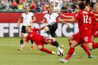 Jul 4, 2015; Edmonton, Alberta, CAN; England defender Alex Greenwood (14) and Germany forward Anja Mittag (11) battle for control of the ball in extra time during the third place match of the FIFA 2015 Women's World Cup at Commonwealth Stadium. England defeated Germany 1-0 in extra time. Erich Schlegel-USA TODAY Sports -