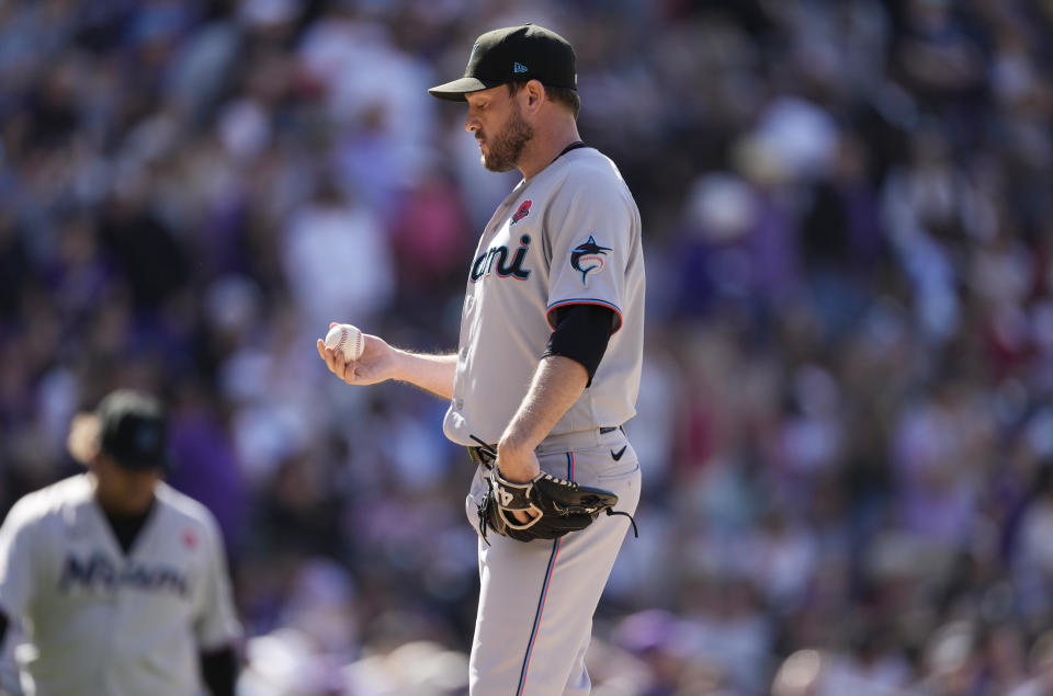 Miami Marlins relief pitcher Cole Sulser reacts after giving up a double to Colorado Rockies pinch-hitter Yonathan Daza to allow in three runs in the seventh inning of a baseball game Monday, May 30, 2022, in Denver. (AP Photo/David Zalubowski)
