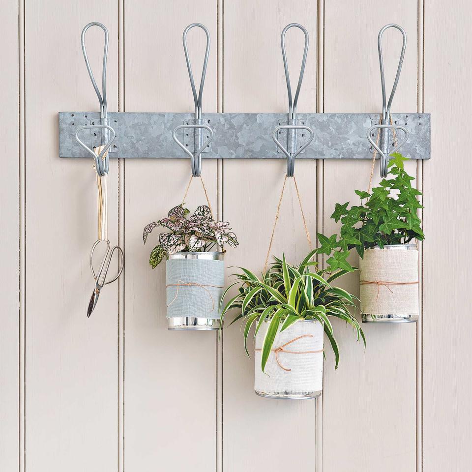 <p> If space is at a premium, then making the most of the verticals is the way forward. And, we&apos;re loving this easy upcycling trick using old tins.&#xA0; </p> <p> They don&apos;t have to be particularly pretty &#x2013; just regular old cans will do. Wash them out, remove the labels, and glue a pretty piece of fabric around them, secured with a piece of jute. With an extra piece of jute attached to the top, they can make gorgeous hanging plant plots, or even containers for LED candles. </p> <p> Looking for more clever upcycling hacks? Our guide on how to use salvage for garden upcycling ideas has plenty. </p>