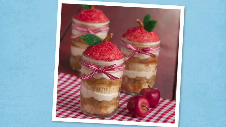 Caramel Apple Cupcakes in a Jar sits on a blue background (cake in a jar)