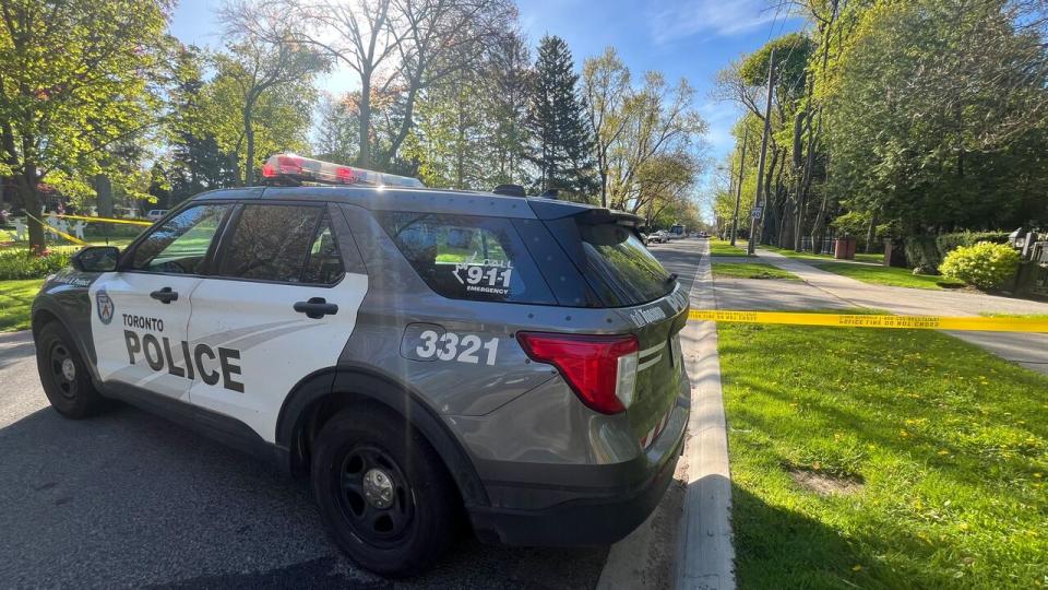 Toronto police at the scene of a shooting outside Canadian rapper Drake's mansion on Tuesday. (Dale Manucdoc/CBC - image credit)