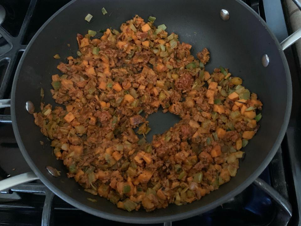 trader joes holiday hash cooked in black pan on stove