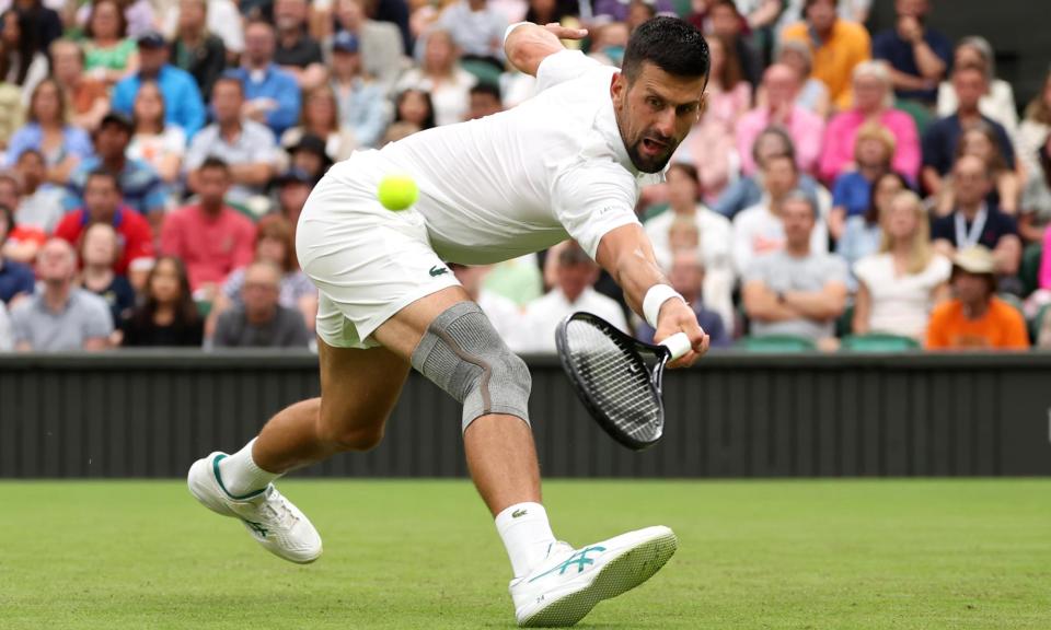 <span>Novak Djokovic, with his new knee brace, stretches against Vit Kopriva.</span><span>Photograph: Sean M Haffey/Getty Images</span>