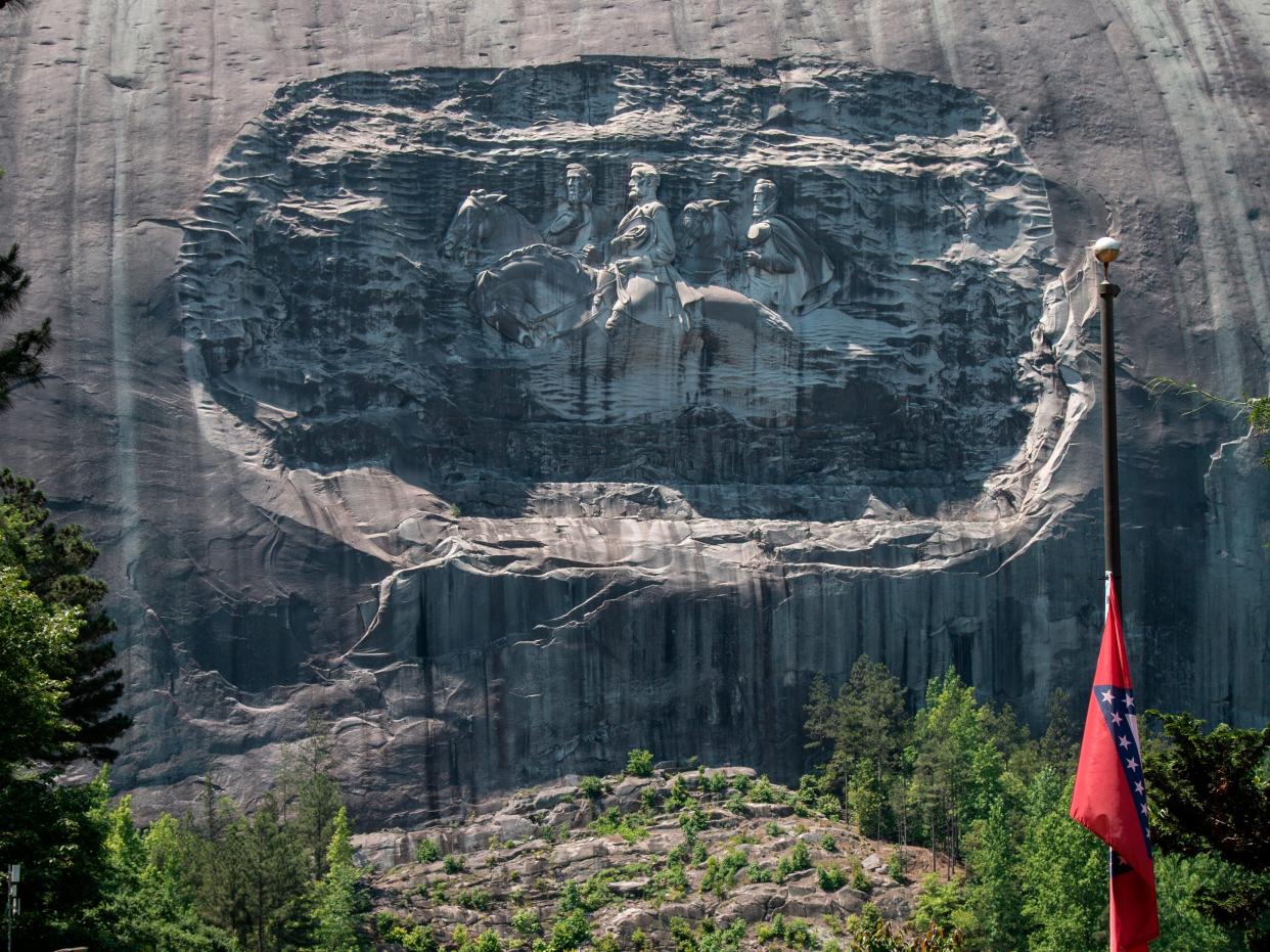 A carving on Stone Mountain honoring Confederate generals is shown on Monday, May 24, 2021, in Stone Mountain, Georgia.
