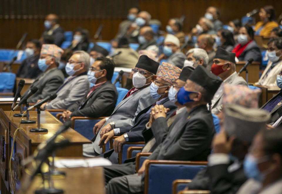 Members of parliament sit as they begin session in Kathmandu, Nepal, Sunday, March 7, 2021. Nepal’s Parliament reinstated by the nation's Supreme Court began session on Sunday that would likely determine the future of the prime minister and government. (AP Photo/Niranjan Shrestha)