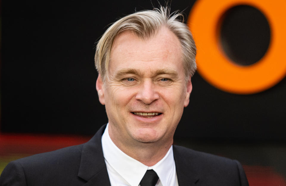 Close-up of Christopher at a media event smiling