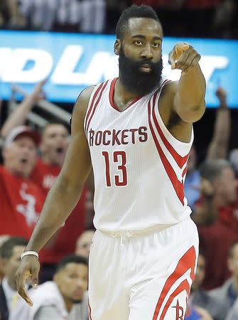 Nov 2, 2015; Houston, TX, USA; Houston Rockets guard James Harden (13) reacts after making a three point basket against the Oklahoma City Thunder in the fourth quarter at Toyota Center. Rocket won 110 to 105. Mandatory Credit: Thomas B. Shea-USA TODAY Sports