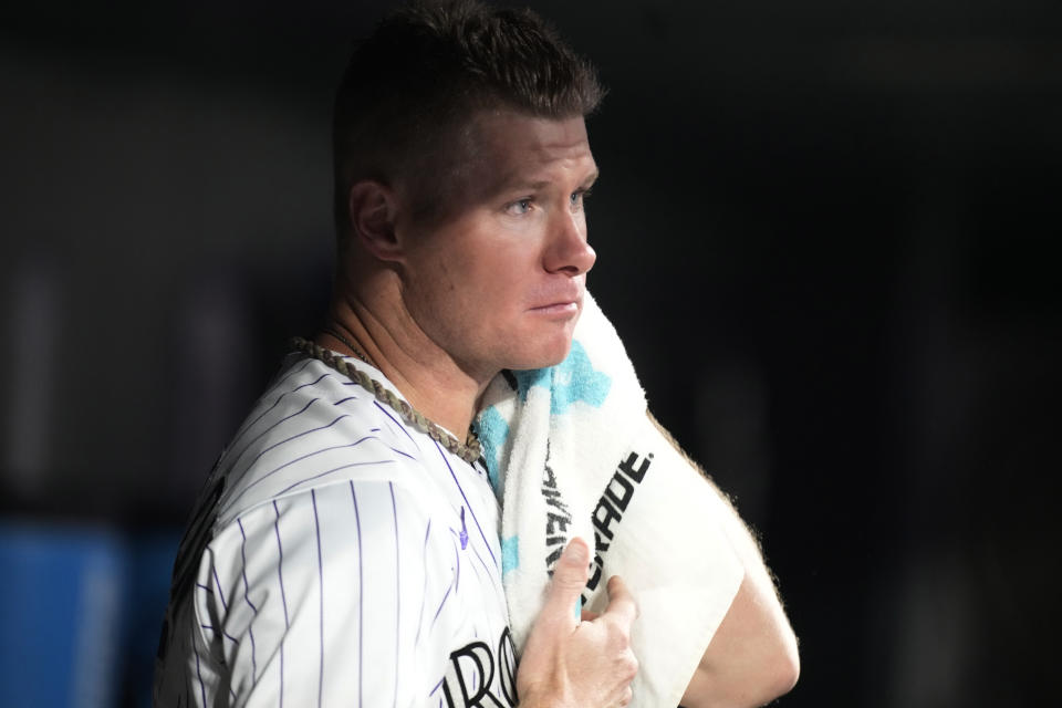 Colorado Rockies starting pitcher Chase Anderson watches from the dugout after retiring the San Francisco Giants during the seventh inning of a baseball game Friday, Sept. 15, 2023, in Denver. (AP Photo/David Zalubowski)