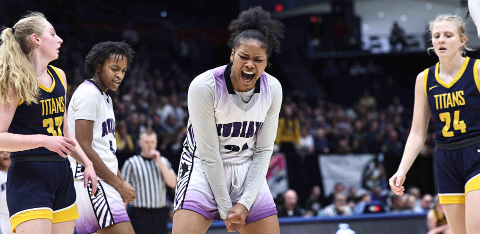 Africentric's Natiah Nelson reacts during the Nubians' Division III state final victory over Ottawa-Glandorf on March 16 at University of Dayton Arena. The Nubians will pursue a third consecutive championship next winter in Division V instead of III.