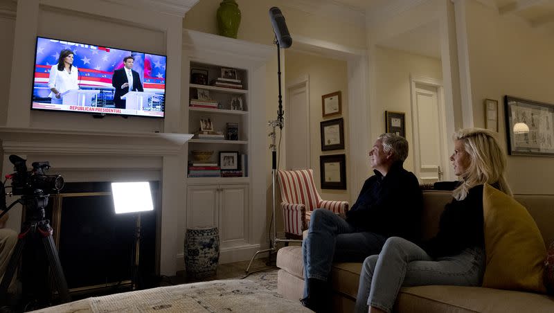 Jon Huntsman Jr. and his wife Mary Kaye watch the GOP presidential debate at their Salt Lake City home on Wednesday, Nov. 8, 2023.