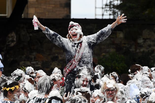 First year students at the University of St. Andrews participate in the annual Raisin Monday shaving foam fight, on Oct. 18. The Raisin Monday costumed foam fight is the culmination of a week of mentoring to welcome first year students. (Photo: ANDY BUCHANAN/AFP via Getty Images)