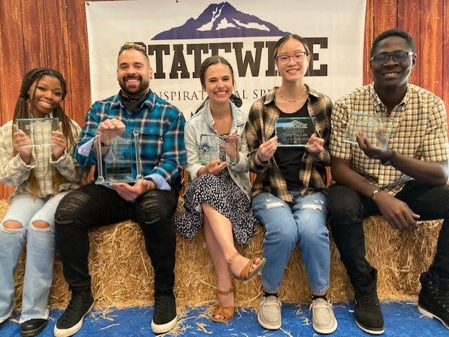 The 2022 Statewide Inspirational Speech Championship contestants, pictured left to right: TeAirra Lawson of Olympic College, State Champion Levi Pixton of Olympic College, Lyndi Klacik of Centralia College, Yoyo Lau of Whatcom Community College, and runner-up Josaphat Boesinga of Bellevue College.