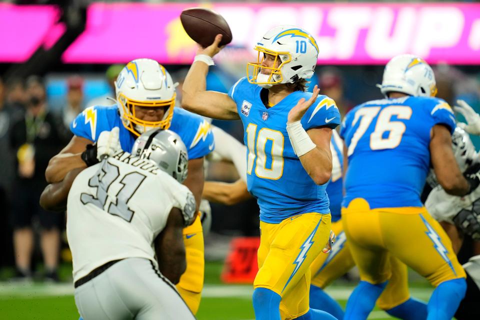 Chargers QB Justin Herbert (10) needs to complete season sweep of Raiders to get Bolts into playoffs.