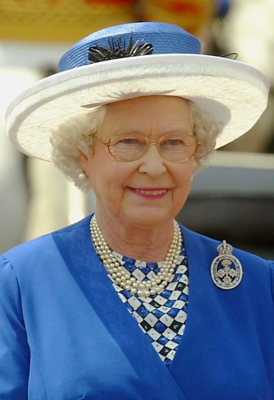 Queen Elizabeth wears blue and white at Trooping the Colour in 2003.