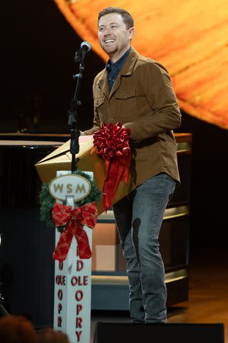 <p>Chris Hollo/Grand Ole Opry</p> Scotty McCreery at the Grand Ole Opry in Nashville on Dec. 3, 2023