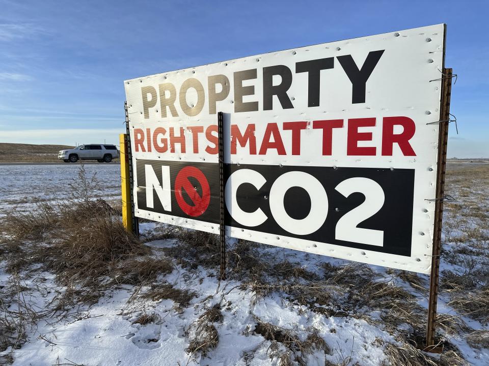 A sign reading "Property rights matter, no CO2" stands near Strasburg, N.D., Jan. 11, 2024. Iowa public utility regulators on Tuesday, June 25, 2024 gave approval for a controversial carbon dioxide pipeline proposed for the Midwest, but the company will has many hoops to jump through before it can begin construction. (AP Photo/Jack Dura)