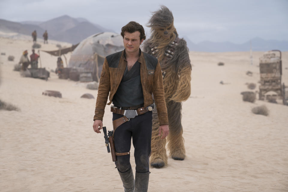 This image released by Lucasfilm shows Alden Ehrenreich and Joonas Suotamo in a scene from "Solo: A Star Wars Story."<span class="copyright">Jonathan Olley—AP</span>