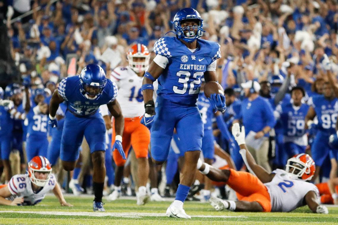 The 76-yard touchdown return by Kentucky linebacker Trevin Wallace (32) off a blocked Florida field goal was the pivotal play in UK’s 20-13 victory over the Gators in 2021.